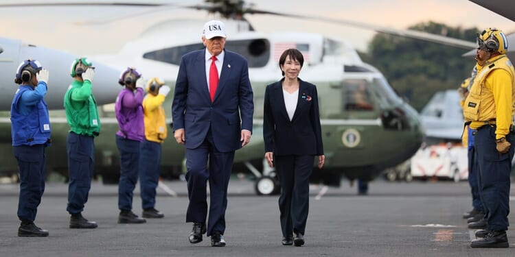 Donald Trump and Sanae Takaichi walking together.