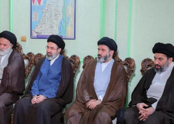 Ali Khamenei's four sons sitting next to each other.