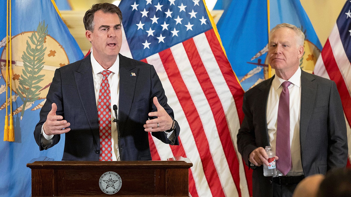 Oklahoma Gov. Kevin Stitt and Alan Armstrong
