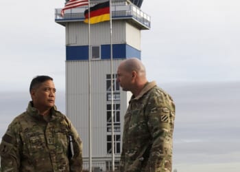 Two US Army officers speaking at a base in Germany.