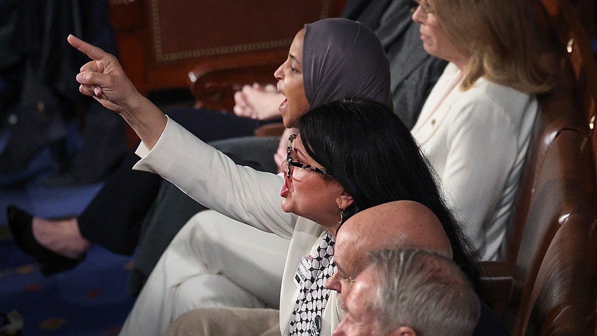 Rep. Rashida Tlaib (D-MI) and Rep. Ilhan Omar (D-MI) shout