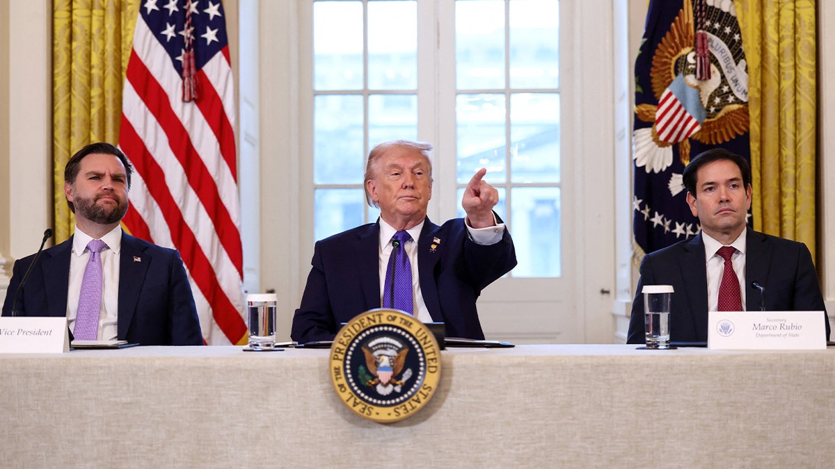 Vance, Trump and Rubio sit at a long table