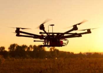 A drone in flight at sunset.