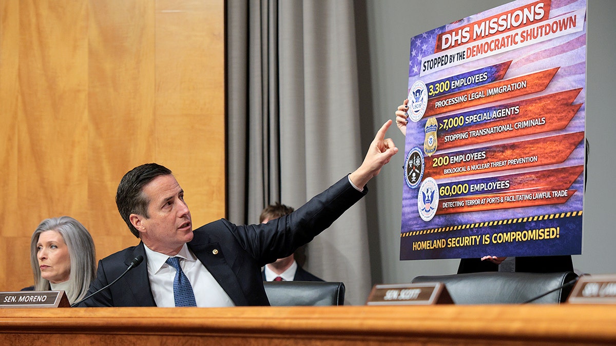 Sen. Bernie Moreno pointing at a DHS Missions sign