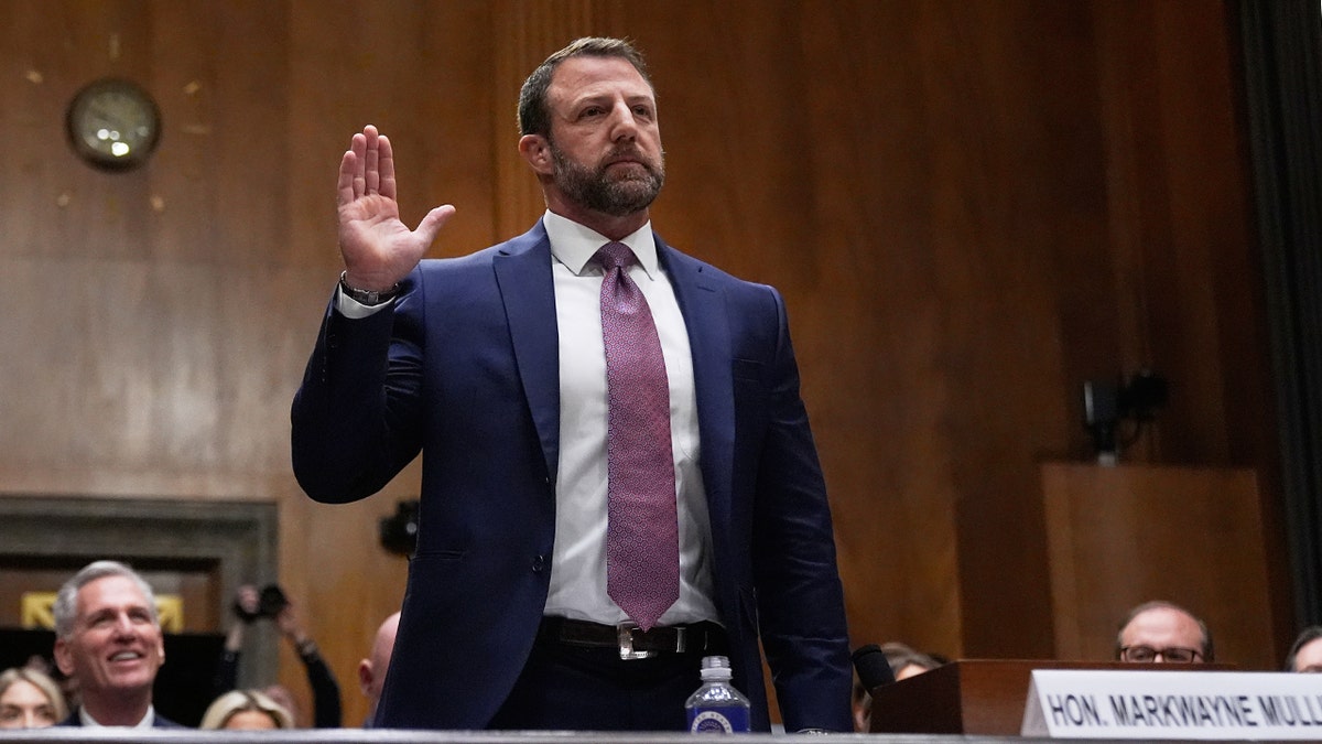 Sen. Markwayne Mullin being sworn in at a Senate Homeland Security hearing on Capitol Hill