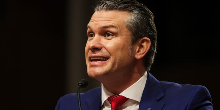 Pete Hegseth smiling during his Senate confirmation hearing.
