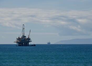 An offshore drilling platform in open waters.