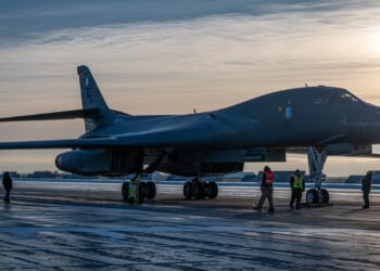 A B-1 Lancer on a runway at dawn.