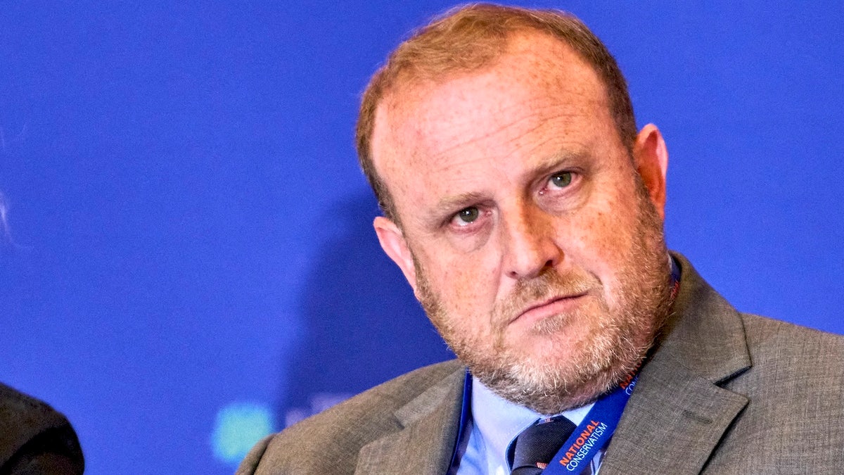 Jeremy Carl looks on with his head tilted in disbelief