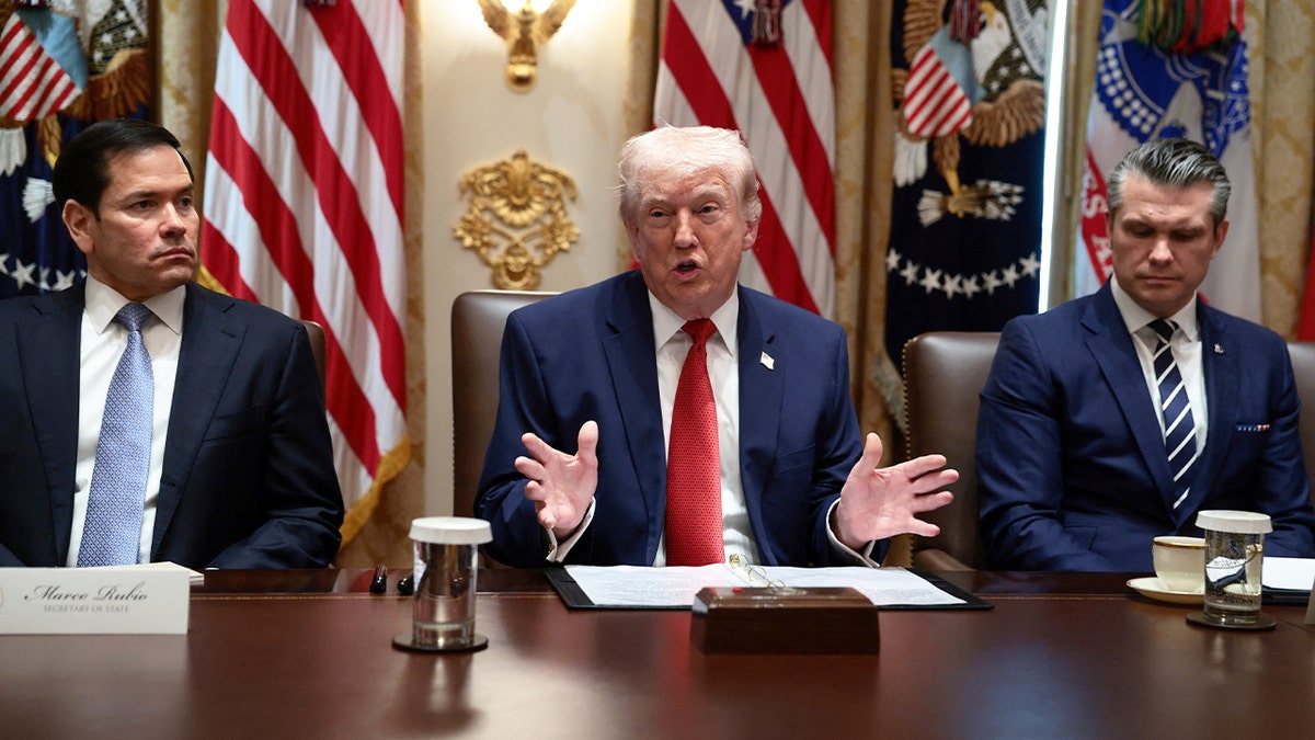 U.S. President Donald Trump, sitting next to Secretary of State Marco Rubio and Defense Secretary Pete Hegseth, speaks during a cabinet meeting at the White House in Washington, D.C., U.S., March 26, 2026.