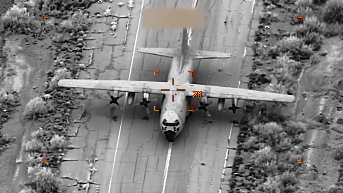 Airplane on ground before being hit in strike