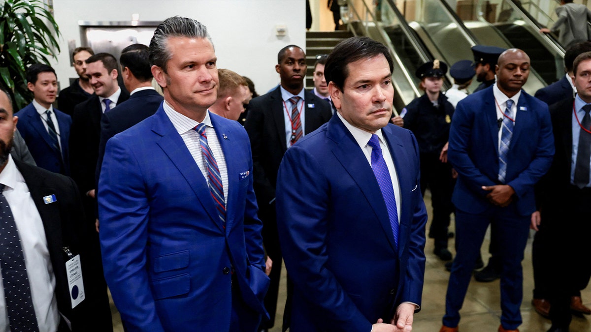 U.S. Secretary of State Marco Rubio and U.S. Defense Secretary Pete Hegseth wait to speak to the media while other Senators finish on the day of a briefing for the House of Representatives on the situation in Venezuela, on Capitol Hill in Washington, D.C., U.S., January 7, 2026