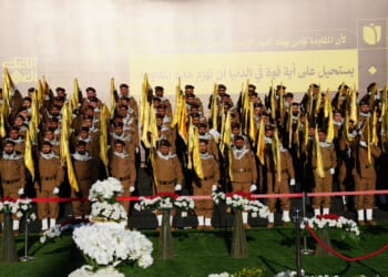 A group of uniformed Hezbollah fighters at a funeral.
