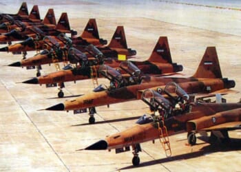 A lineup of Iranian Air Force F-5 Tigers in the desert.