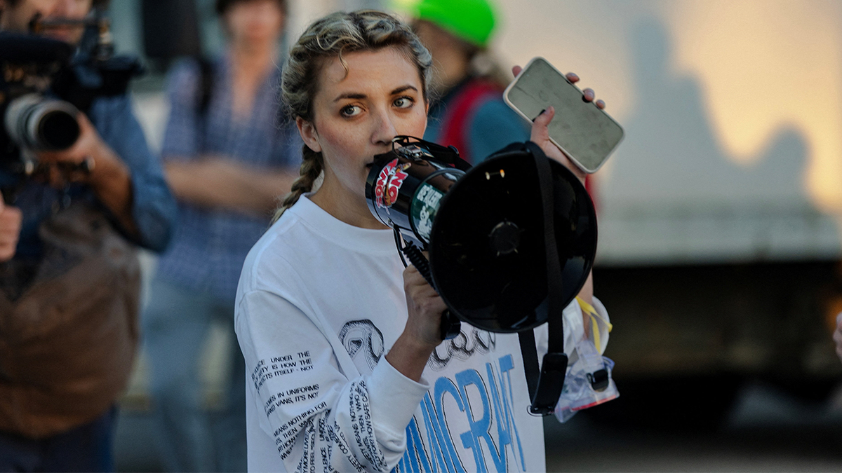 Kat Abughazaleh protests outside an ICE facility