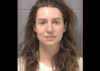 Woman accused of fatally shooting father of her 2 children amid surprise massage — and then turning gun on his parents