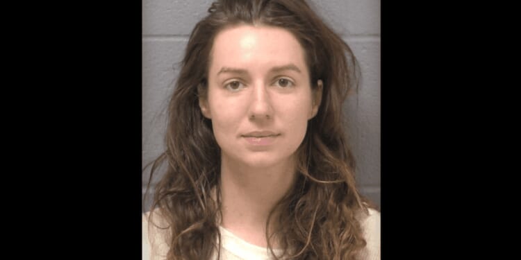 Woman accused of fatally shooting father of her 2 children amid surprise massage — and then turning gun on his parents