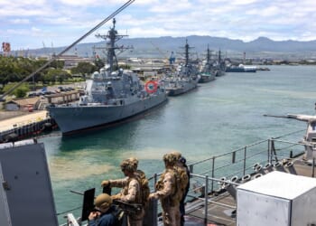 The USS Carl M. Levin anchored in Hawaii, with a mysterious deck weapon circled.