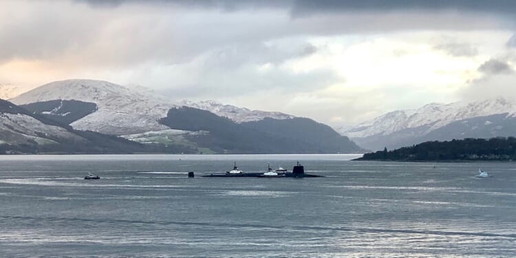 A Vanguard-class submarine sailing through icy waters.