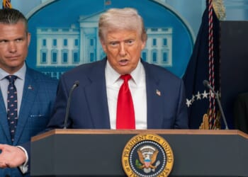 President Donald Trump gives a press conference at the White House, with Secretary of Defense Pete Hegseth behind him.