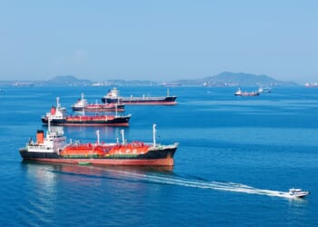 A group of oil tankers at sea.