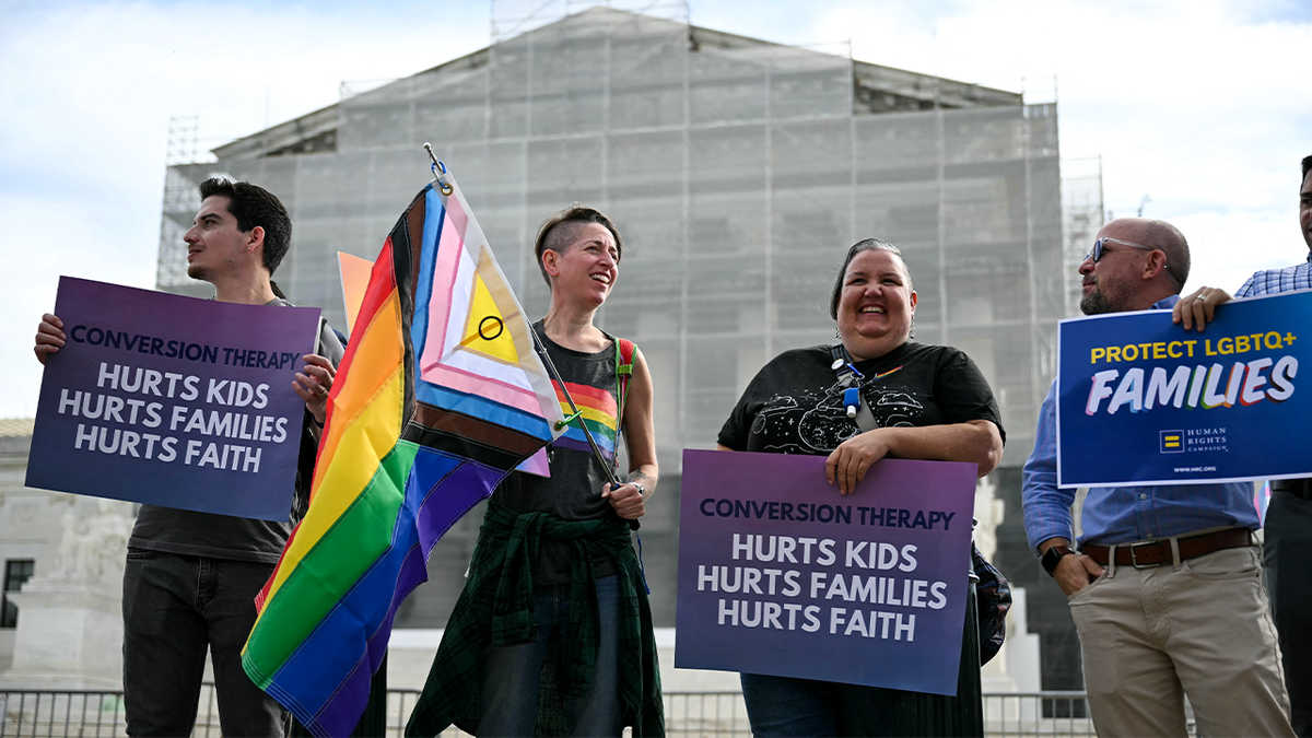 Protesters gather in front of U.S. Supreme Court to support Colorado ban on so-called "conversion therapy."