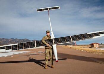 A soldier carrying a K1000ULE drone.