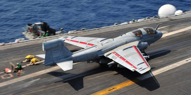 An EA-6B Prowler taking off from an aircraft carrier.