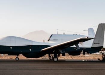 An MQ-4C Triton drone on the tarmac at a US naval airbase in Italy.