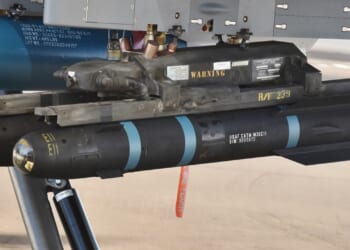 Two Hellfire missiles mounted on an aircraft.