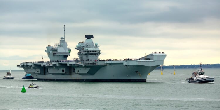The HMS Prince of Wales aircraft carrier at sea.