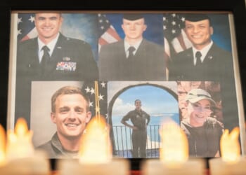 A display showing the six airmen who lost their lives in a recent KC-135 crash in Iraq.