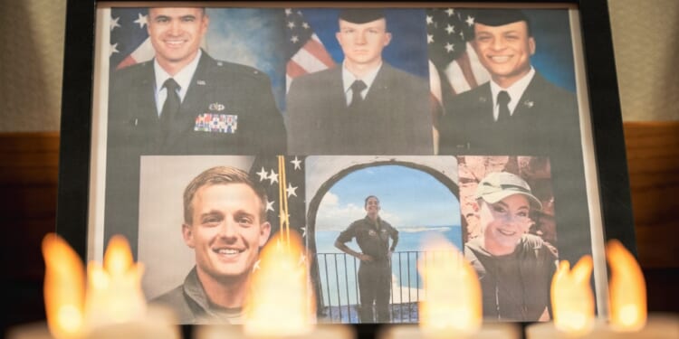 A display showing the six airmen who lost their lives in a recent KC-135 crash in Iraq.