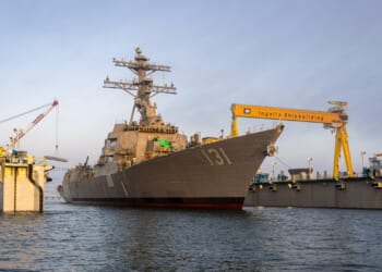 The future USS George M. Neal leaves port in Mississippi.