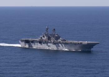 The USS Tripoli amphibious assault ship at sea.